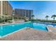 Large community swimming pool with ample lounge seating and ocean views at 415 Ocean Creek Dr. # 2245, Myrtle Beach, SC 29572