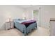 Bedroom features a queen-sized bed, bedside tables, and a window with blinds at 4171 Wrens Crossing, Little River, SC 29566