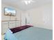 Bedroom features a queen-sized bed, dresser with a TV, and ensuite bathroom at 4171 Wrens Crossing, Little River, SC 29566