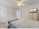 This cozy bedroom is complete with a ceiling fan, tv, and natural light at 4171 Wrens Crossing, Little River, SC 29566