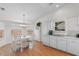 Bright dining area featuring lots of natural light and white cabinetry at 4171 Wrens Crossing, Little River, SC 29566