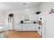 White kitchen showcases modern appliances, ample counter space, and recessed lighting at 4171 Wrens Crossing, Little River, SC 29566