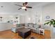 Open living room featuring hardwood floors, vaulted ceilings, and ample natural light at 4171 Wrens Crossing, Little River, SC 29566