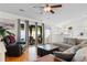 Bright living room featuring hardwood floors, access to the patio, and an adjacent kitchen at 4171 Wrens Crossing, Little River, SC 29566