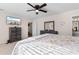 Spacious main bedroom with a decorative bed frame, dresser, and an ensuite bath at 4171 Wrens Crossing, Little River, SC 29566