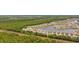 Aerial view of homes in a community surrounded by lush green forest and winding waterways at 4359 Livorn Loop # 4359, Myrtle Beach, SC 29579