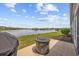 Beautiful backyard with a lake view, grill, and fire pit at 4359 Livorn Loop # 4359, Myrtle Beach, SC 29579