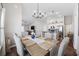 Bright dining area with a chandelier, and views into the modern kitchen at 4359 Livorn Loop # 4359, Myrtle Beach, SC 29579