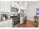 Kitchen featuring white cabinets, stainless steel appliances and granite countertops at 4359 Livorn Loop # 4359, Myrtle Beach, SC 29579