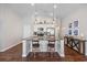 Charming kitchen with an island with pendant lights, modern appliances and natural light at 4359 Livorn Loop # 4359, Myrtle Beach, SC 29579