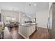 Open-concept kitchen featuring stainless steel appliances, granite counters, and an island with a sink at 4359 Livorn Loop # 4359, Myrtle Beach, SC 29579