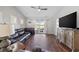 Spacious living room featuring hardwood floors, sliding glass doors and a cozy, neutral color palette at 4359 Livorn Loop # 4359, Myrtle Beach, SC 29579