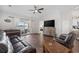 Comfortable living room with hardwood floors, ceiling fan, and sliding doors to the screened porch at 4359 Livorn Loop # 4359, Myrtle Beach, SC 29579