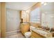 This bathroom features dual vanities with granite countertops, wood cabinets, and a large mirror at 4501 S Ocean Blvd., North Myrtle Beach, SC 29582