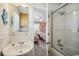 This ensuite bathroom leads into a bedroom and offers a tub/shower combo and single granite countertop sink at 4501 S Ocean Blvd., North Myrtle Beach, SC 29582