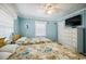 This bedroom offers two beds, a large window, a dresser, and coastal décor for a beachy feel at 4501 S Ocean Blvd., North Myrtle Beach, SC 29582