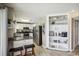 Well-equipped kitchen featuring white cabinets, stainless appliances, and adjacent breakfast nook at 4501 S Ocean Blvd., North Myrtle Beach, SC 29582