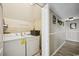 The laundry room has a washer, dryer and wire shelves for additional storage at 4501 S Ocean Blvd., North Myrtle Beach, SC 29582
