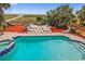 Overhead pool view with lounge chairs, brick patio, and tropical beach access at 4501 S Ocean Blvd., North Myrtle Beach, SC 29582