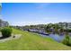 Backyard has views of a canal, boat dock, and houses at 4524 N Plantation Harbour Dr. # B3, Little River, SC 29566