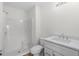 Clean bathroom with white shower, toilet, and vanity with luxury vinyl floors at 4524 N Plantation Harbour Dr. # B3, Little River, SC 29566