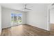A bright bedroom featuring durable floors and sliding doors to a balcony at 4524 N Plantation Harbour Dr. # B3, Little River, SC 29566
