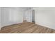 Bedroom with light wood-look flooring with a closet and white doors at 4524 N Plantation Harbour Dr. # B3, Little River, SC 29566