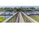 A wooden dock on the water offers views of waterfront homes and boat slips at 4524 N Plantation Harbour Dr. # B3, Little River, SC 29566