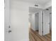 A bright hallway with modern flooring leads to various rooms inside a condominium at 4524 N Plantation Harbour Dr. # B3, Little River, SC 29566