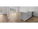 Bright kitchen with stainless appliances opens to living space and large sliding doors at 4524 N Plantation Harbour Dr. # B3, Little River, SC 29566