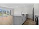 The kitchen offers a bar-top counter and stainless appliances, with a sliding door to the outside at 4524 N Plantation Harbour Dr. # B3, Little River, SC 29566