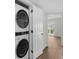 Convenient laundry room with washer, dryer, white door, and wood-look flooring at 4524 N Plantation Harbour Dr. # B3, Little River, SC 29566