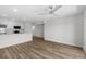Living room with vinyl floor, ceiling fan and kitchen area and stainless appliances at 4524 N Plantation Harbour Dr. # B3, Little River, SC 29566