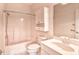 This bathroom features a tub with a shower, toilet, and single sink vanity with mirrored cabinet at 4683 Wild Iris Dr. # 104, Myrtle Beach, SC 29577