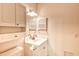 Well-lit bathroom featuring a single sink vanity with storage and a mirrored medicine cabinet at 4683 Wild Iris Dr. # 104, Myrtle Beach, SC 29577