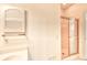 Bright bathroom featuring a glass-enclosed shower and a medicine cabinet for storage at 4683 Wild Iris Dr. # 104, Myrtle Beach, SC 29577