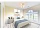 Inviting bedroom with a queen-size bed, neutral decor, and a bright window at 4683 Wild Iris Dr. # 104, Myrtle Beach, SC 29577