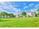 Well-maintained community lawn with benches and mature trees, creating a serene atmosphere at 4683 Wild Iris Dr. # 104, Myrtle Beach, SC 29577