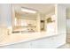 Well-lit kitchen with a breakfast bar, white cabinetry, and modern appliances at 4683 Wild Iris Dr. # 104, Myrtle Beach, SC 29577