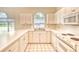 Bright kitchen with white cabinets, countertops, and appliances, plus ample counter space at 4683 Wild Iris Dr. # 104, Myrtle Beach, SC 29577