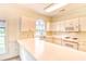 Bright kitchen with white cabinets, appliances, and countertop space with bar seating at 4683 Wild Iris Dr. # 104, Myrtle Beach, SC 29577