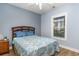 Cozy bedroom showcasing a bed with blue patterned bedding and a window with blinds at 4812 Magnolia Lake Dr. # 102, Myrtle Beach, SC 29577