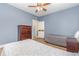 Bright bedroom featuring two beds, wood floors and a wooden dresser at 4812 Magnolia Lake Dr. # 102, Myrtle Beach, SC 29577