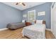 Bright bedroom featuring two beds and a wooden ceiling fan at 4812 Magnolia Lake Dr. # 102, Myrtle Beach, SC 29577