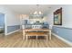 Dining area that features a wooden table, decorative lighting, and seating at 4812 Magnolia Lake Dr. # 102, Myrtle Beach, SC 29577