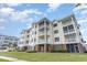 Beautiful condo complex with multiple floors and screened in balconies at 4812 Magnolia Lake Dr. # 102, Myrtle Beach, SC 29577