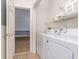 Laundry area with a washer and dryer and an open entrance to the adjacent room at 4812 Magnolia Lake Dr. # 102, Myrtle Beach, SC 29577