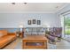 Living room with neutral walls, traditional furniture, and a ceiling fan at 4812 Magnolia Lake Dr. # 102, Myrtle Beach, SC 29577