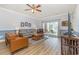 Inviting living room featuring modern decor, a ceiling fan, and patio access at 4812 Magnolia Lake Dr. # 102, Myrtle Beach, SC 29577