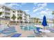 Community swimming pool with lounge chairs and umbrellas for relaxation by the water at 4812 Magnolia Lake Dr. # 102, Myrtle Beach, SC 29577